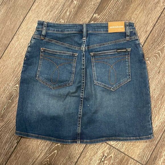 BARELY WORN Dark wash Calvin Klein, jeans skirt, with a few distressed marks - Picture 5 of 5